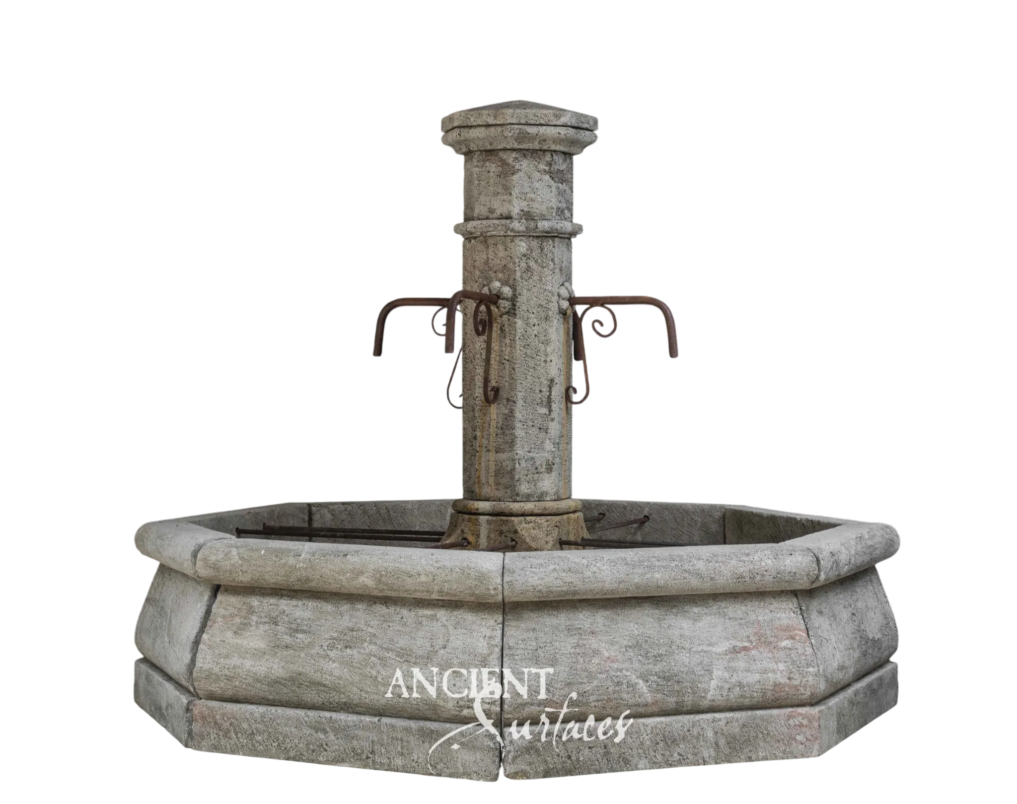 Reclaimed limestone pool fountain with a round shouldered pillar and twin scrolled iron spout arms over an octagonal pool, shown cut out on a plain ground